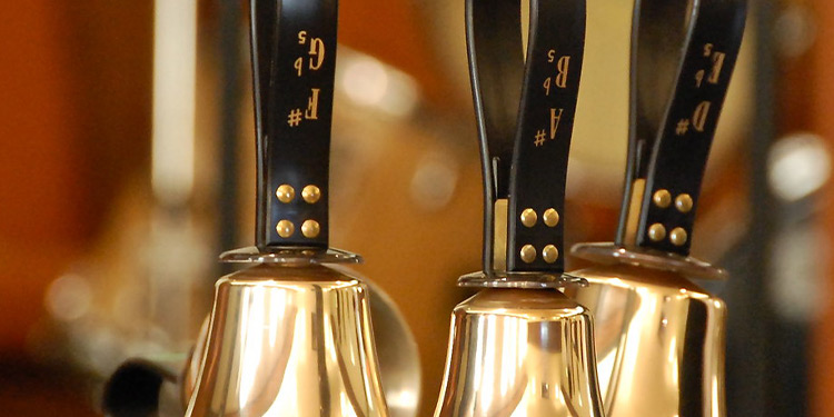 Closeup of three handbells